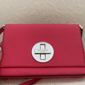New never worn Authentic Kate Spade Mini Crossbody bag in Coral Pink Leather.